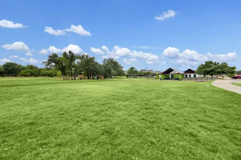 a backyard of a house with lots of green space