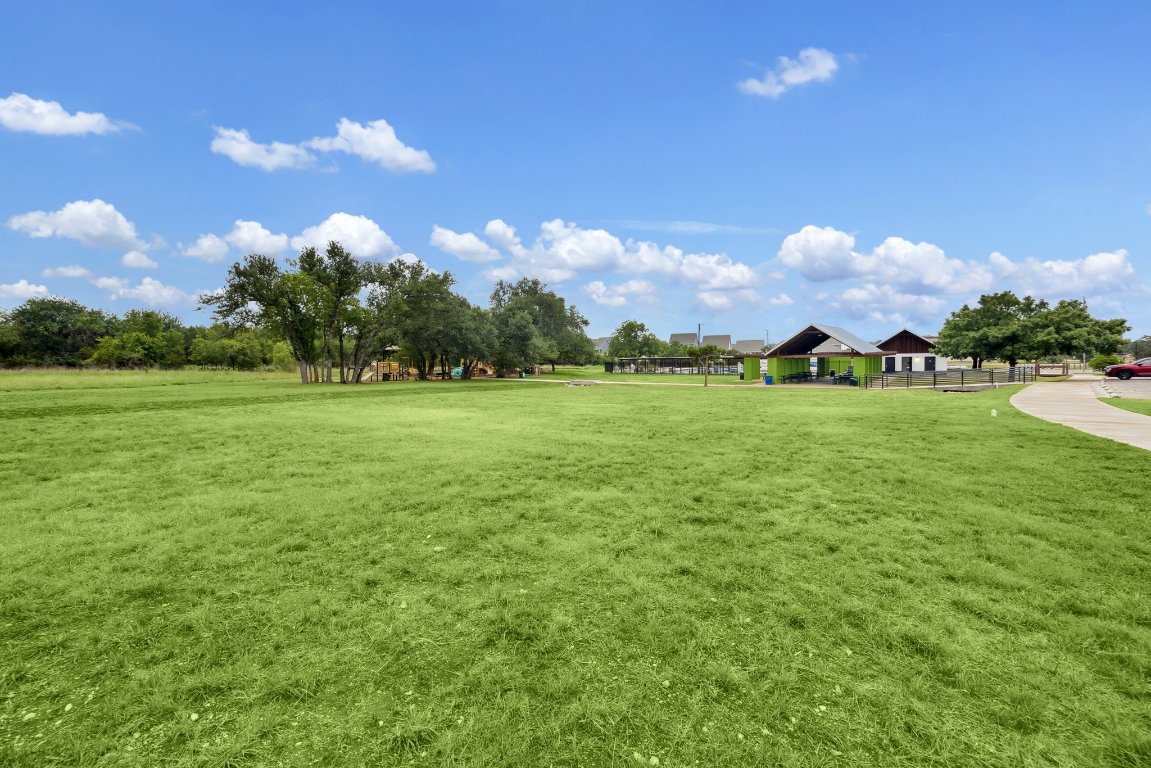 744 Founders Ridge Dripping Springs, TX 78620 - Photo 31 of 32 a backyard of a house with lots of green space