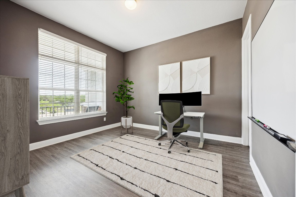 744 Founders Ridge Dripping Springs, TX 78620 - Photo 7 of 32 a view of a workspace with furniture and a window