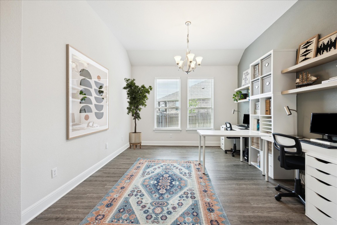 744 Founders Ridge Dripping Springs, TX 78620 - Photo 9 of 32 a living room with furniture and a chandelier