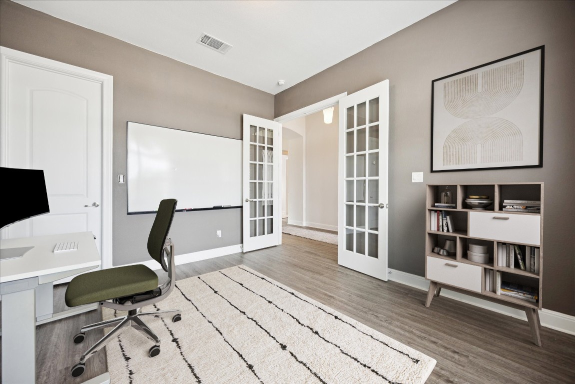 744 Founders Ridge Dripping Springs, TX 78620 - Photo 10 of 32 a view of a workspace with furniture and a window
