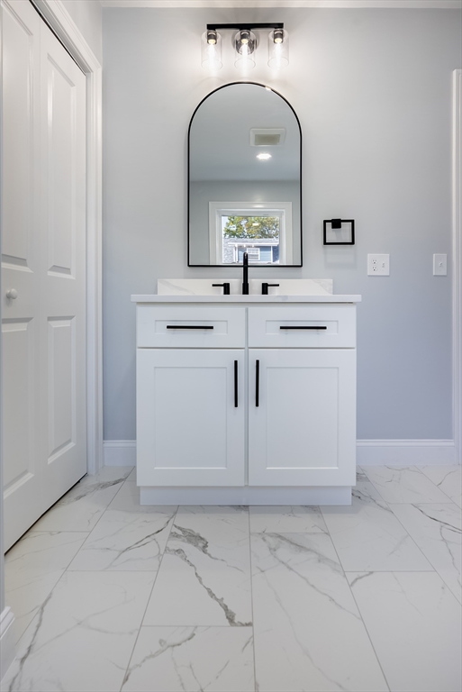 153 Ray Street Fall River, MA 02720 - Photo 12 of 29 a bathroom with a sink and a mirror