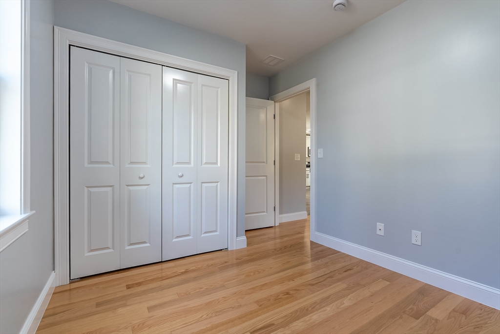 153 Ray Street Fall River, MA 02720 - Photo 17 of 29 a view of an empty room with wooden floor