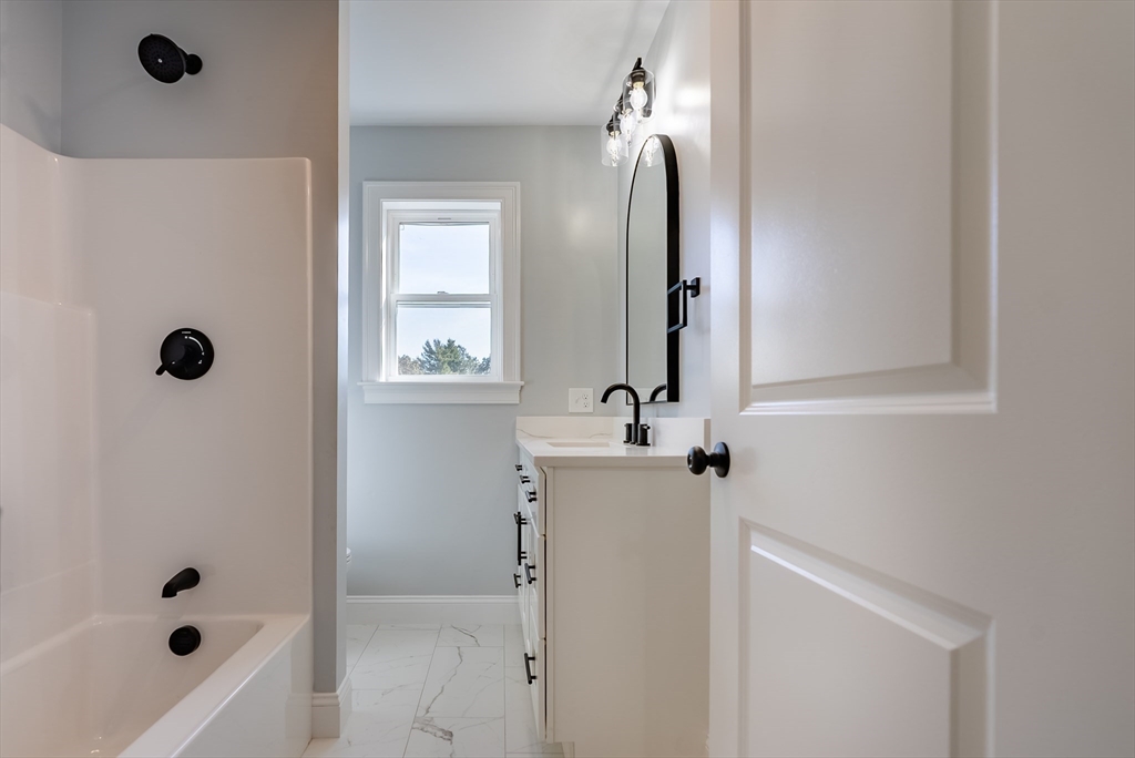 153 Ray Street Fall River, MA 02720 - Photo 19 of 29 a bathroom with a shower and a mirror