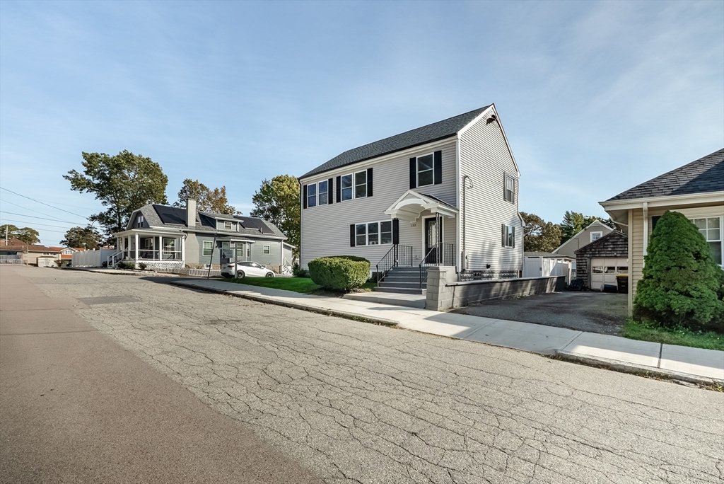 153 Ray Street Fall River, MA 02720 - Photo 2 of 29 a view of a white house with a yard and plants