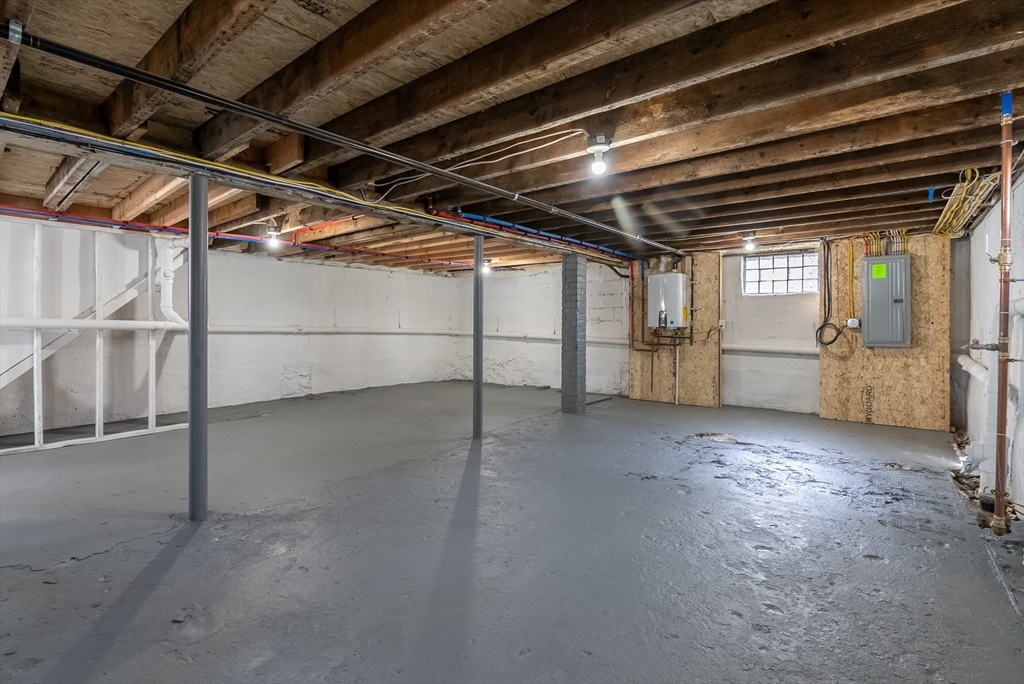 153 Ray Street Fall River, MA 02720 - Photo 22 of 29 a view of empty room with wooden roof