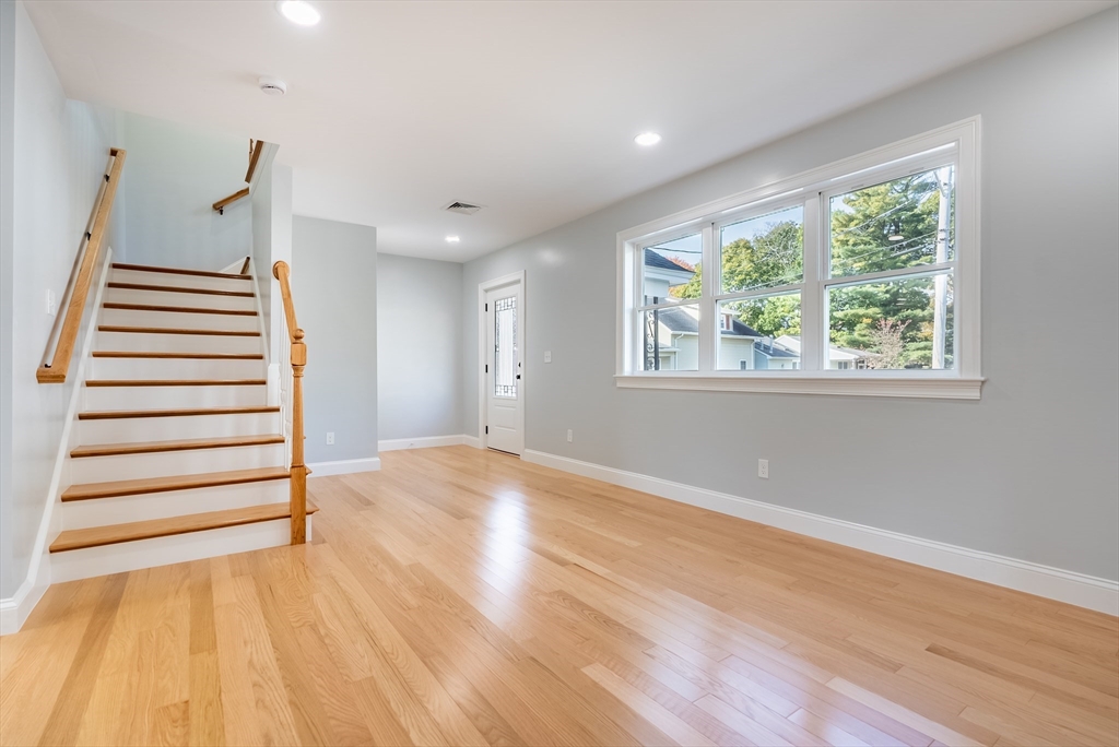 153 Ray Street Fall River, MA 02720 - Photo 8 of 29 a view of an empty room with wooden floor and a window