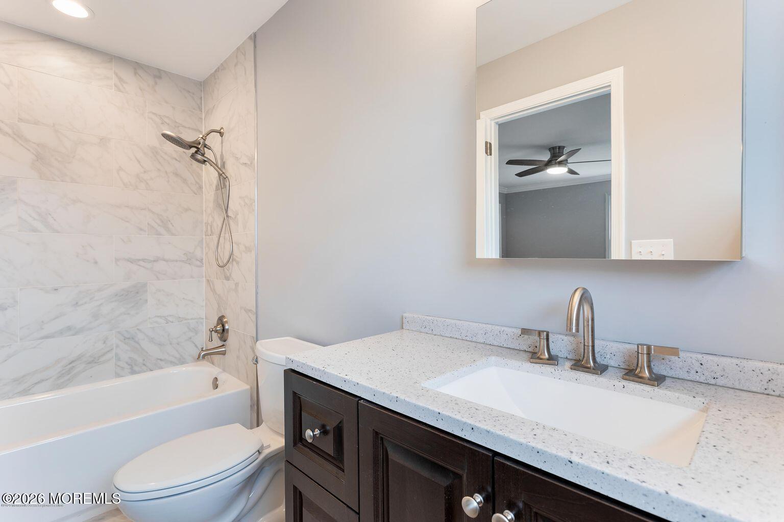 23 Sami Drive Howell, NJ 07731 - Photo 13 of 26 a bathroom with a granite countertop sink a toilet and shower