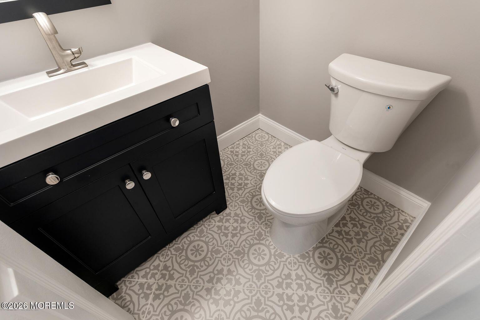 23 Sami Drive Howell, NJ 07731 - Photo 18 of 26 a bathroom with a sink and a toilet