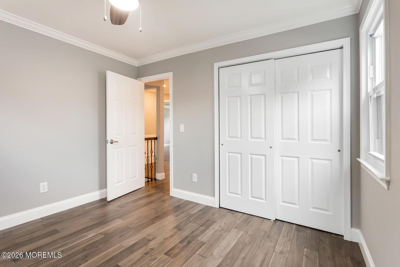 23 Sami Drive Howell, NJ 07731 - Photo 6 of 26 an empty room with wooden floor and closet