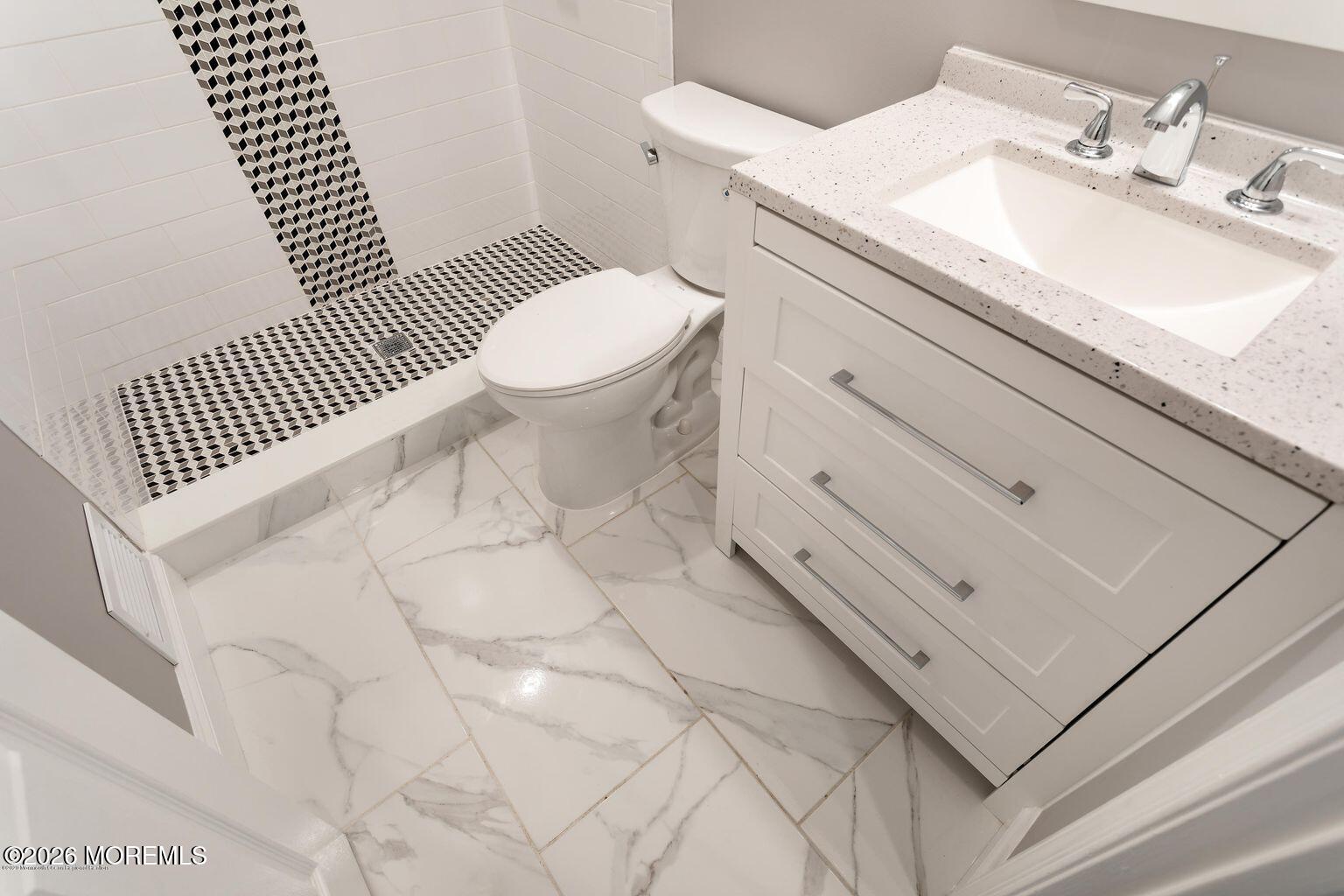 23 Sami Drive Howell, NJ 07731 - Photo 8 of 26 a bathroom with a sink toilet and vanity