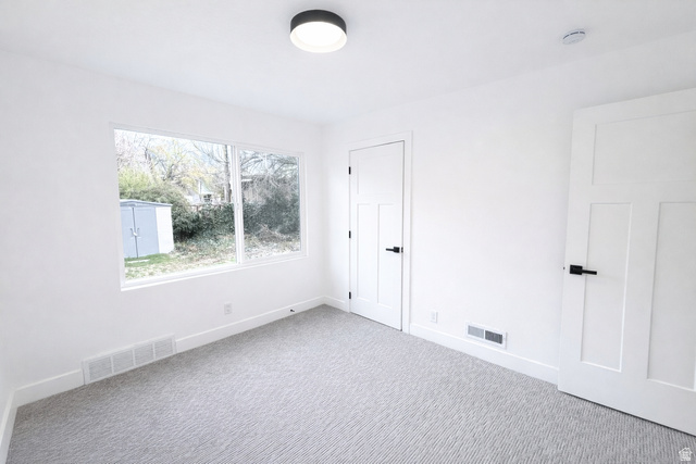 266 700 West Provo, UT 84601 - Photo 9 of 18 Unfurnished bedroom with light colored carpet and baseboards