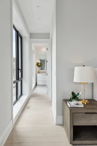 a view of living room with furniture and a lamp