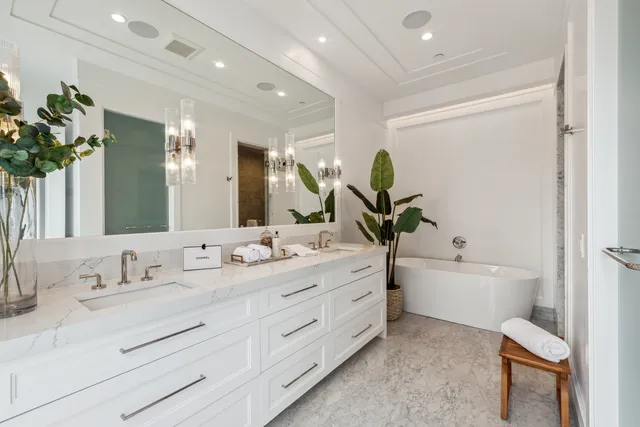 a bathroom with a double vanity sink and a mirror