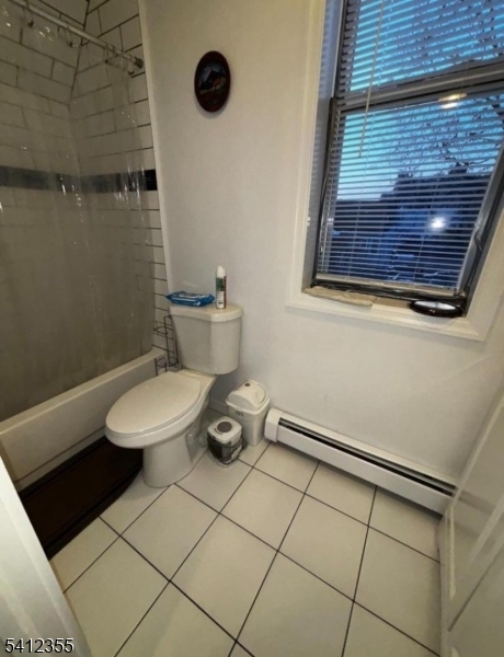 942 East 19th Street Paterson, NJ 07501 - Photo 22 of 26 a bathroom with a toilet and a shower