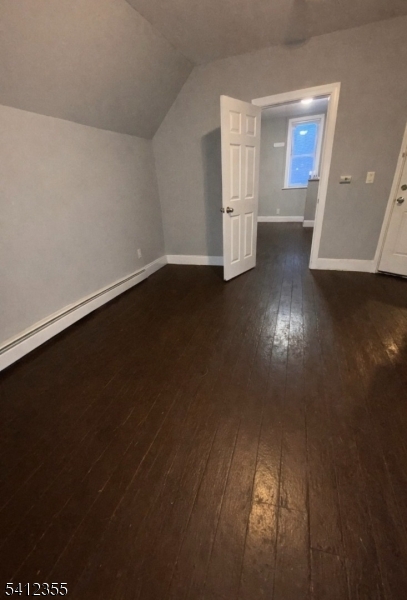 942 East 19th Street Paterson, NJ 07501 - Photo 26 of 26 an empty room with wooden floor and windows
