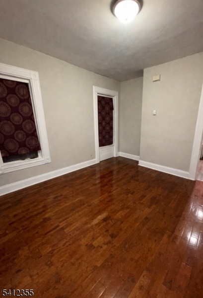 942 East 19th Street Paterson, NJ 07501 - Photo 9 of 26 wooden floor in an empty room