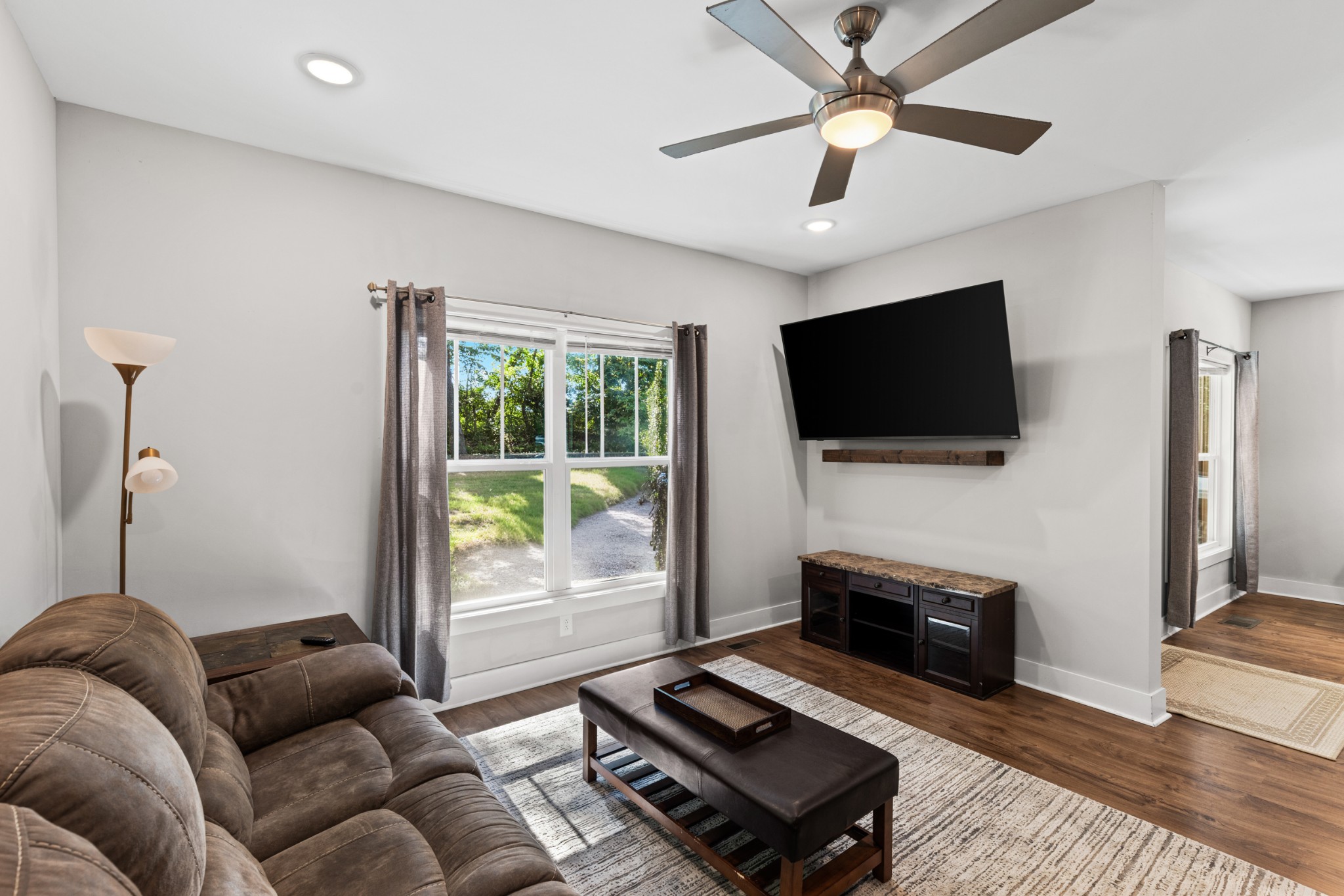 115 North Adams Street Adams, TN 37010 - Photo 10 of 44 a living room with furniture and a flat screen tv