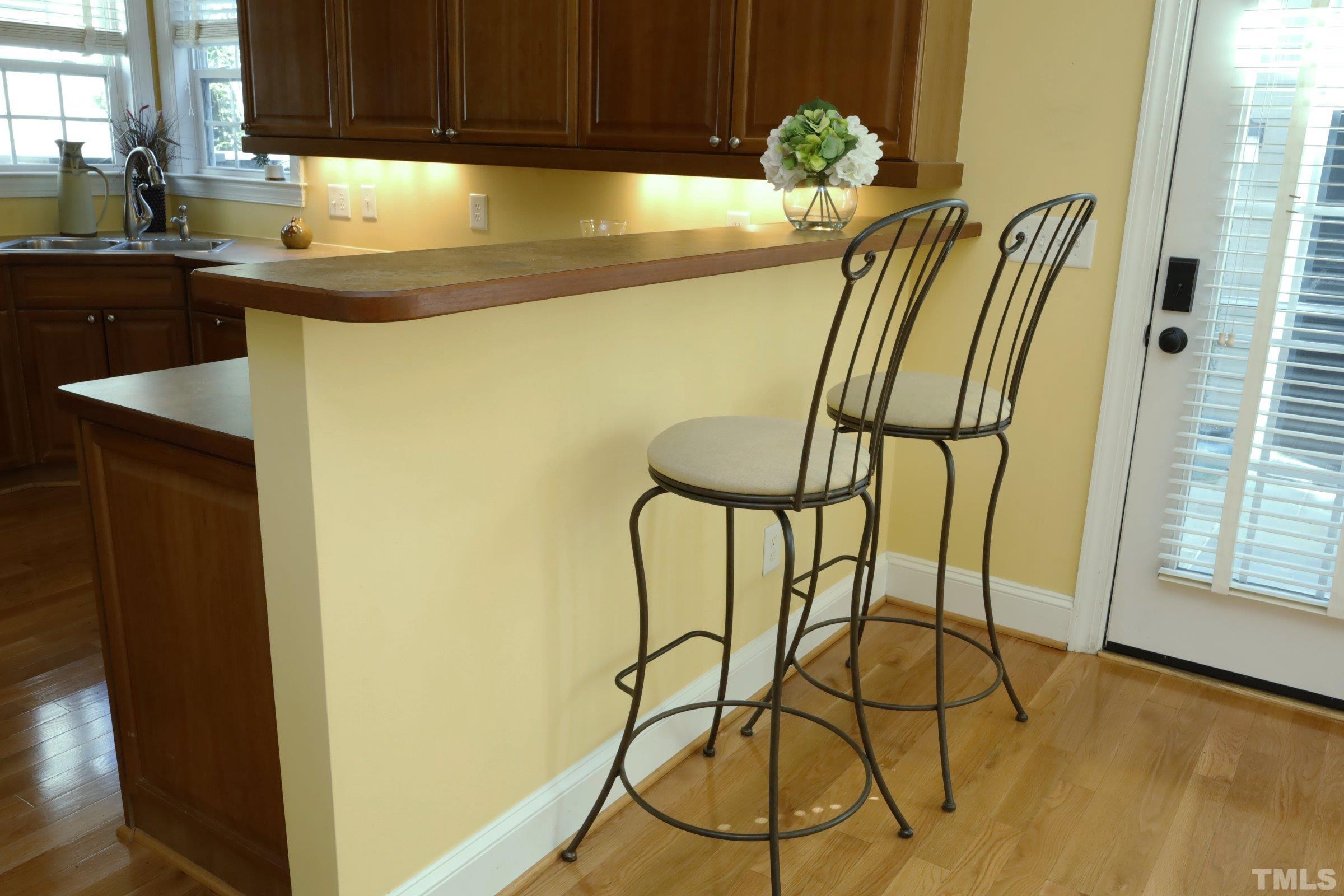 1138 Haynes Street Raleigh, NC 27604 - Photo 18 of 55 a kitchen with a sink and a refrigerator