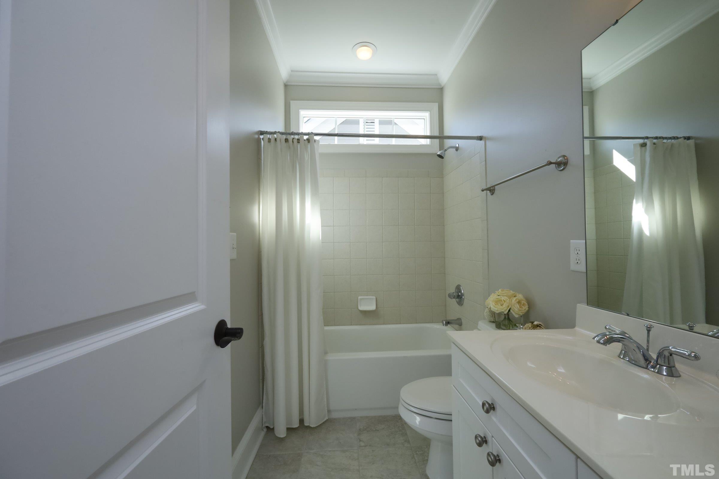 1138 Haynes Street Raleigh, NC 27604 - Photo 30 of 55 a bathroom with a sink a toilet and shower