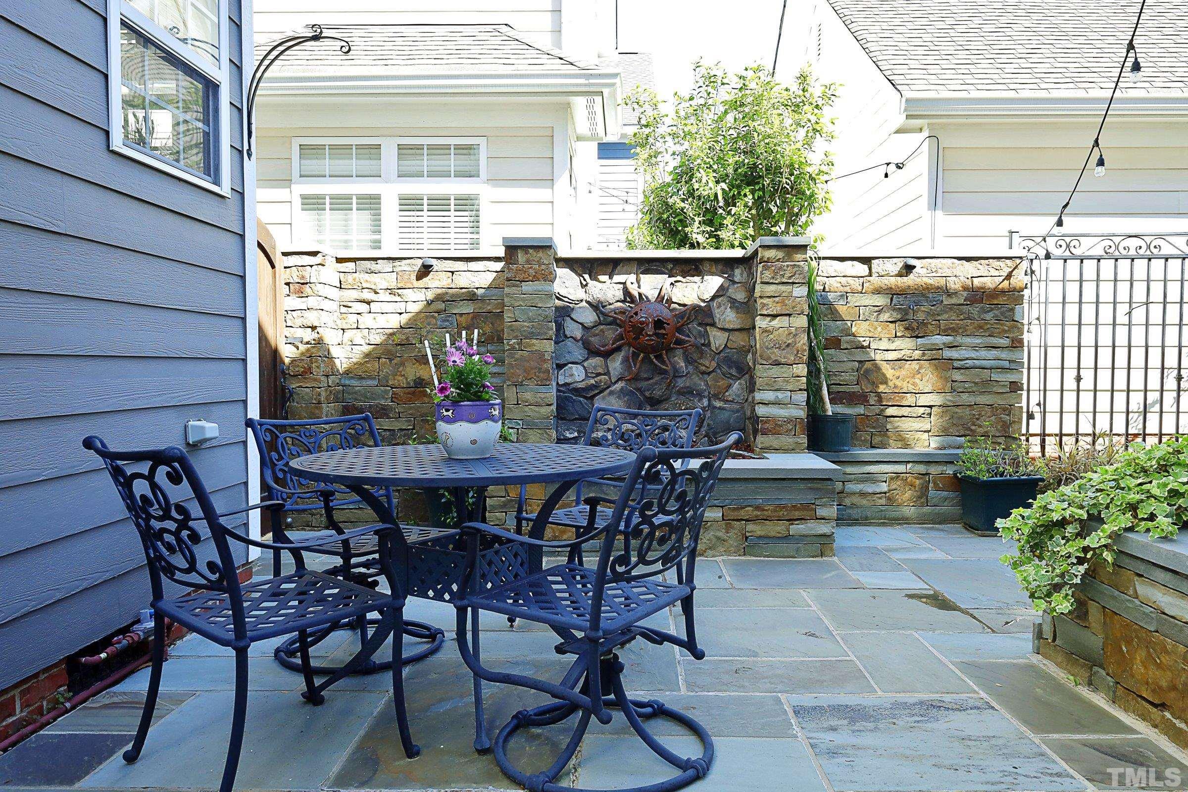 1138 Haynes Street Raleigh, NC 27604 - Photo 33 of 55 a view of a chairs and table in the patio