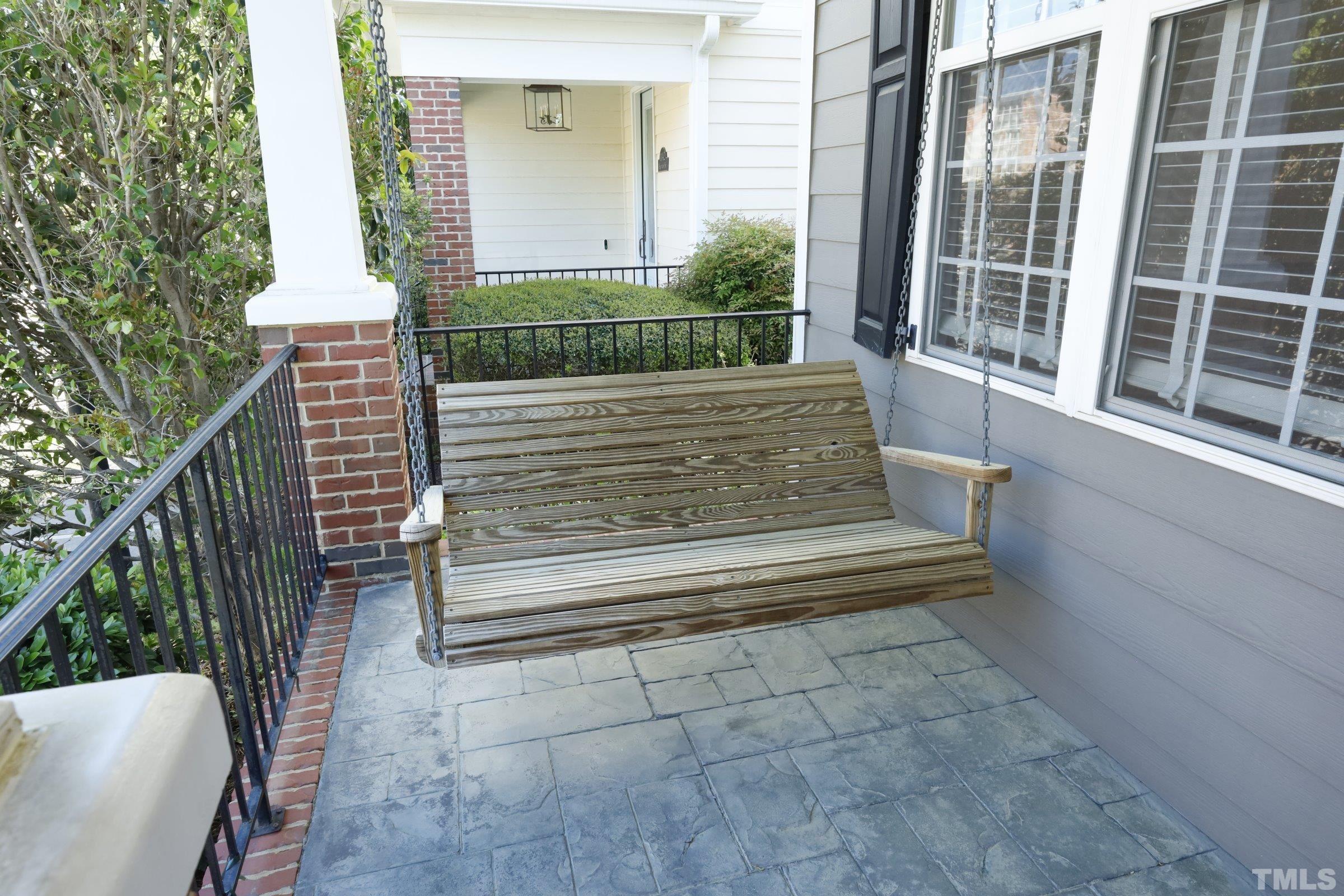 1138 Haynes Street Raleigh, NC 27604 - Photo 4 of 55 a view of a bench in the porch