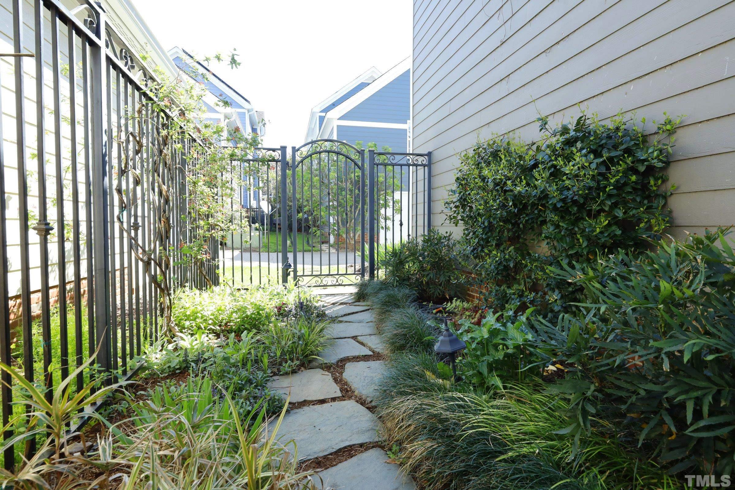 1138 Haynes Street Raleigh, NC 27604 - Photo 42 of 55 a view of a house with a garden