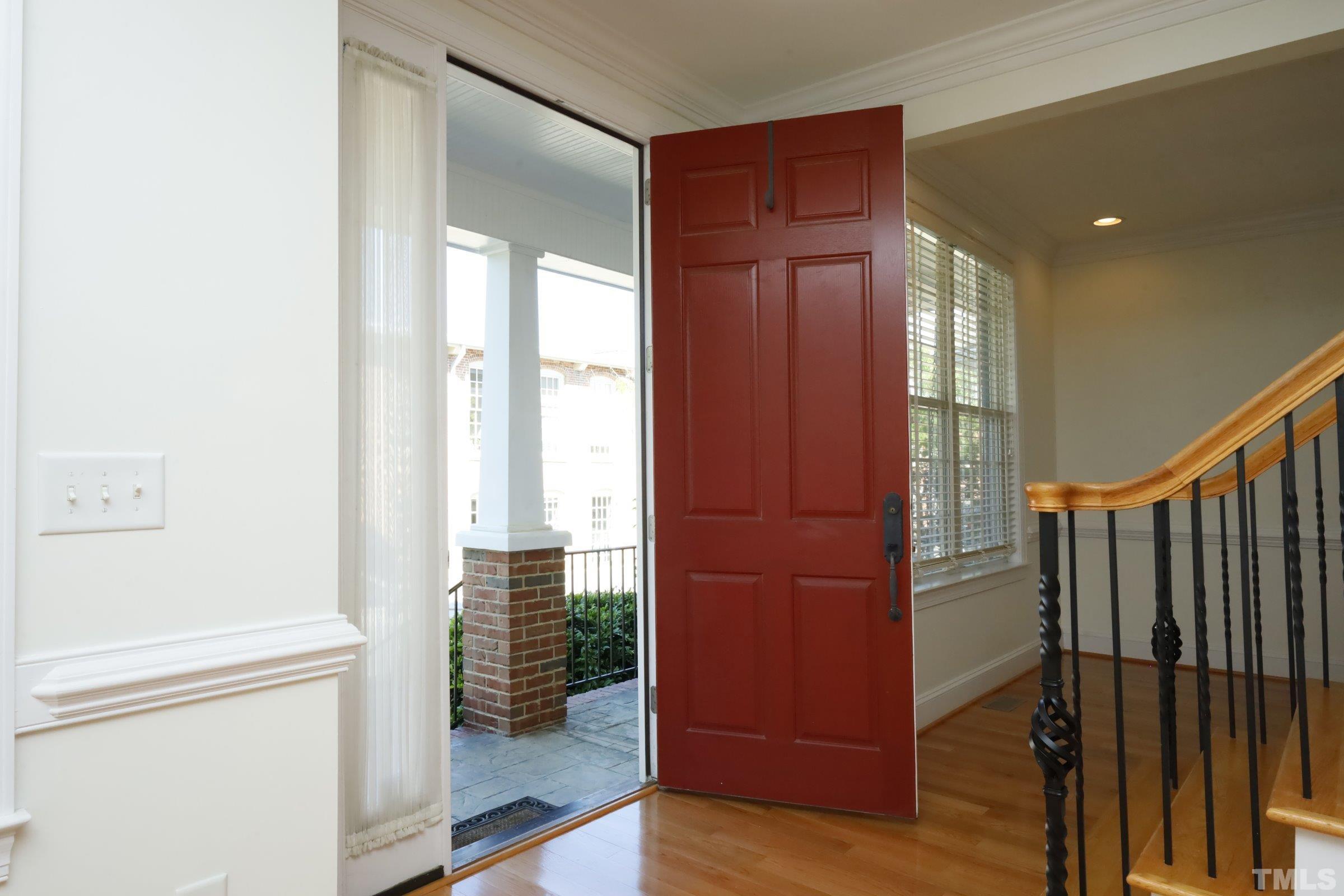 1138 Haynes Street Raleigh, NC 27604 - Photo 6 of 55 a view of entryway with wooden floor and stairs