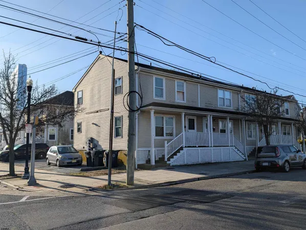 a front view of a house with a street