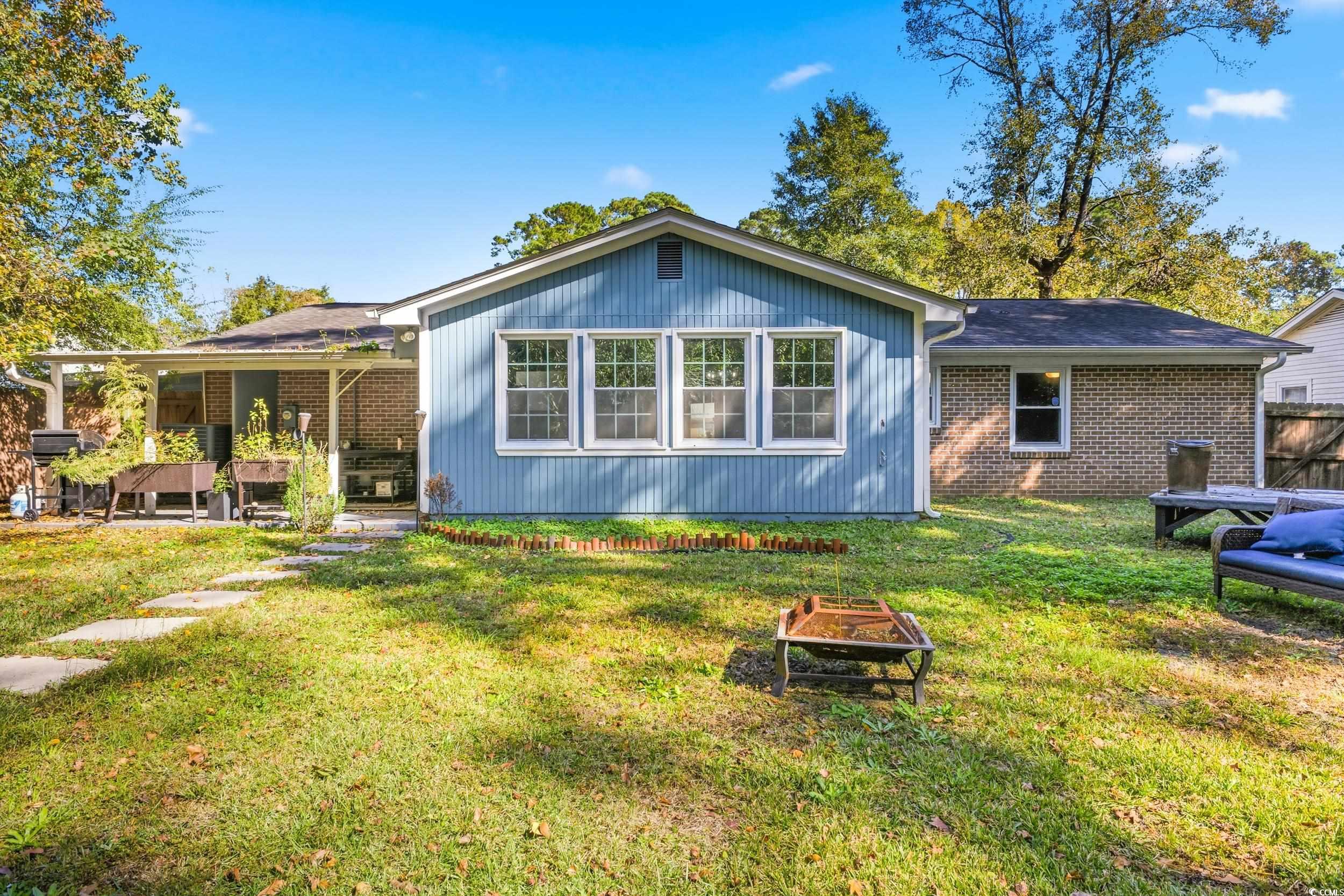 342 Red Fox Road Myrtle Beach, SC 29579 - Photo 37 of 40 Back of property with a lawn and brick siding