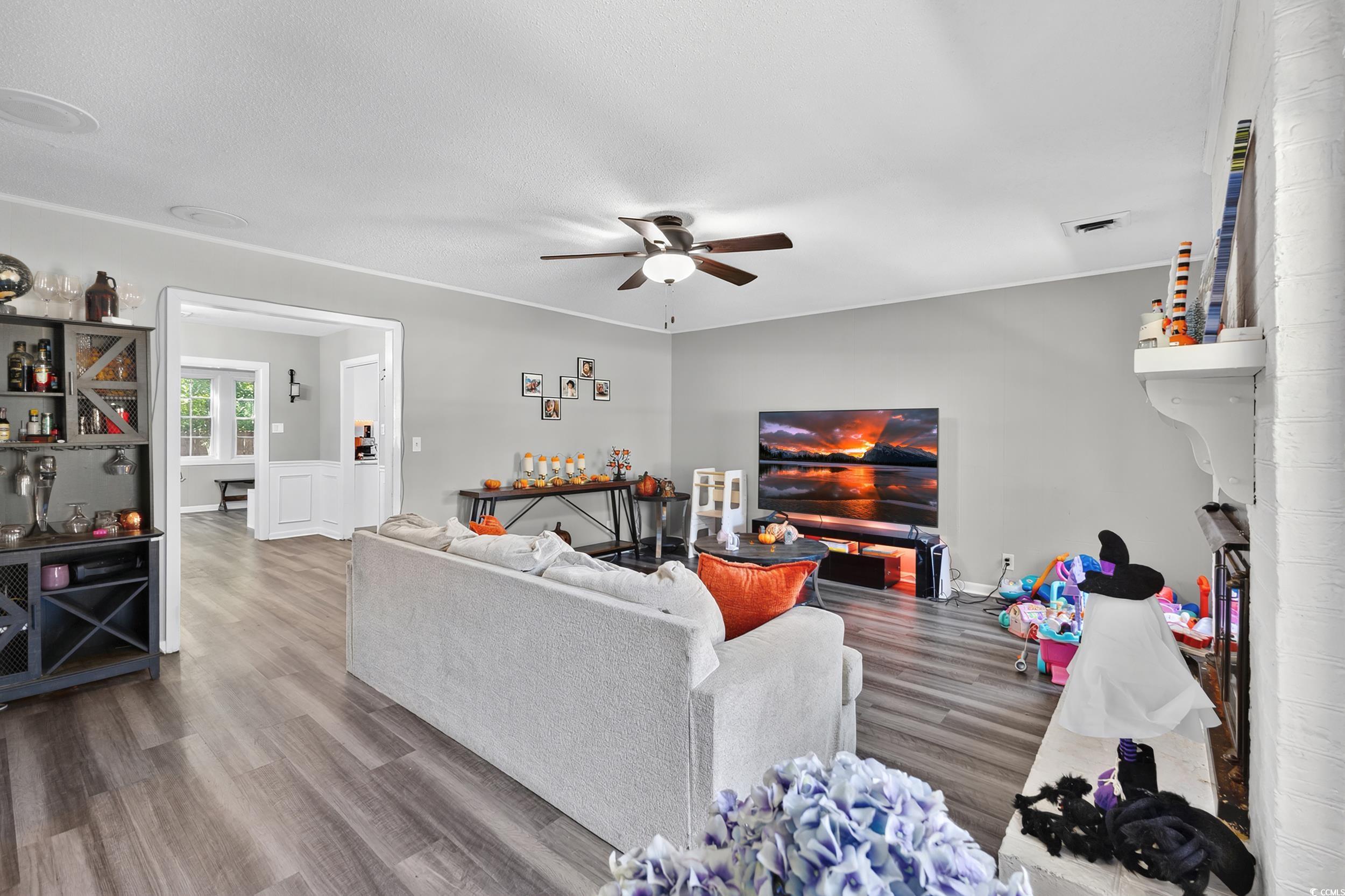 342 Red Fox Road Myrtle Beach, SC 29579 - Photo 4 of 40 Living room with wood finished floors and a ceiling fan