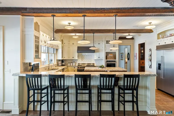 a dining table with chairs and wooden floor