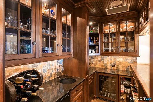 a kitchen with a sink a stove and a window