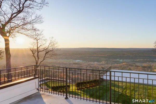 a view of a balcony with a floor to ceiling window
