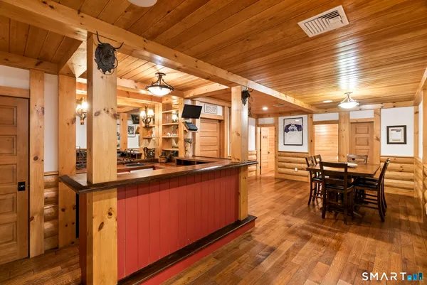 a kitchen with stainless steel appliances granite countertop a stove and cabinets