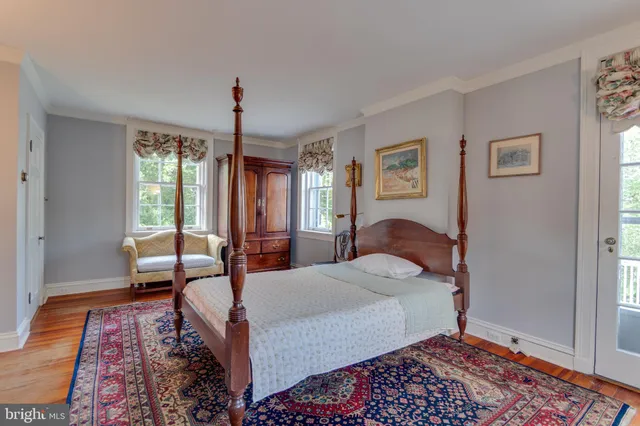 a bed room with a bed and a window