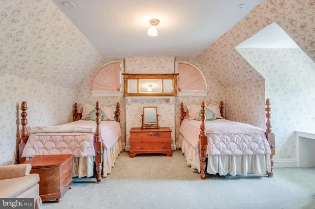 a bedroom with bed and window