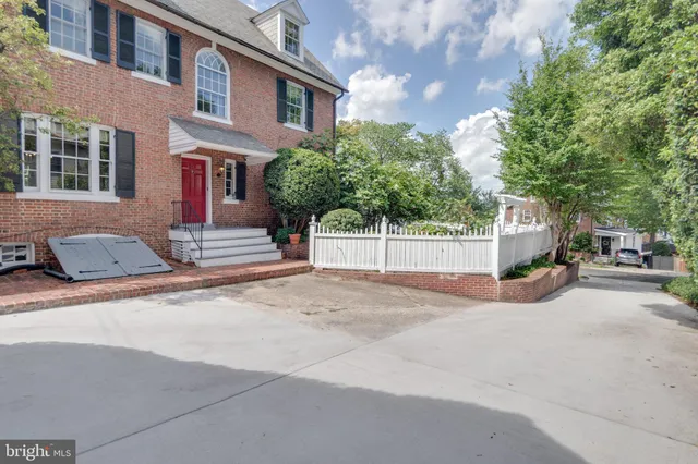a view of a street with a building in the background