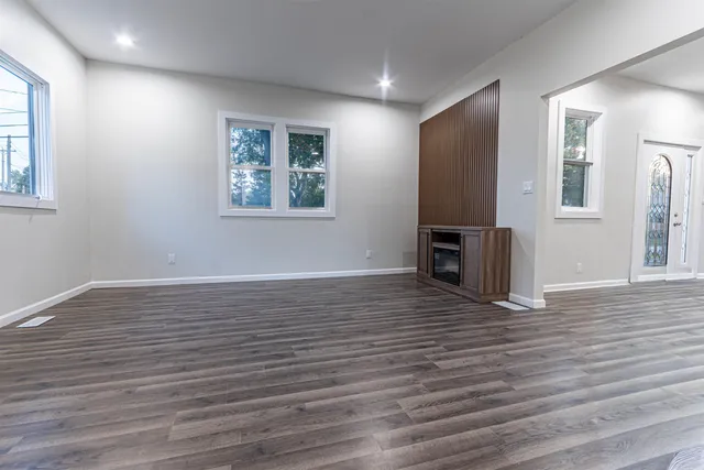a view of a livingroom with wooden floor