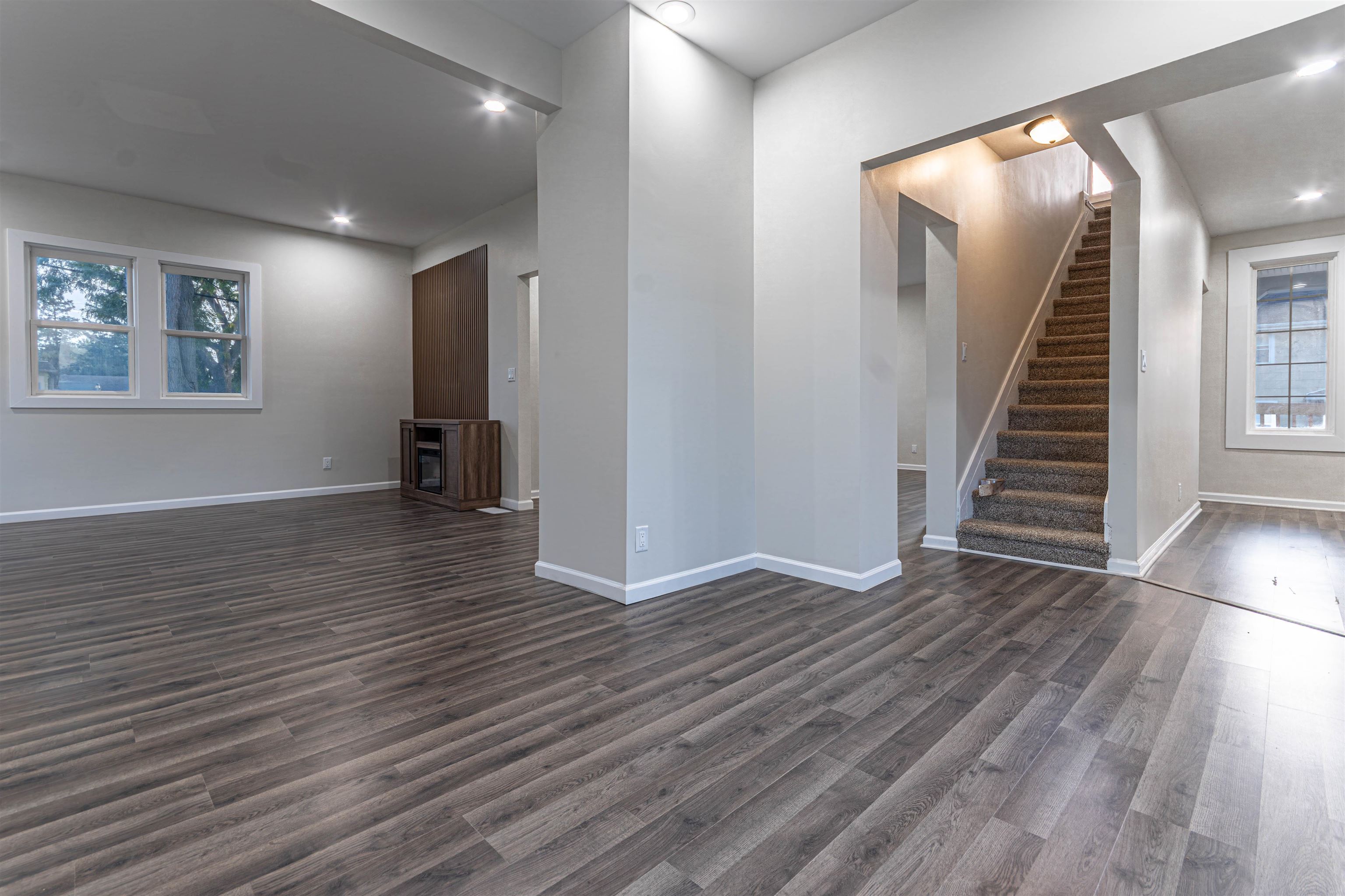 407 Allen Street Belvidere, IL 61008 - Photo 16 of 32 wooden floor in an empty room with a fireplace