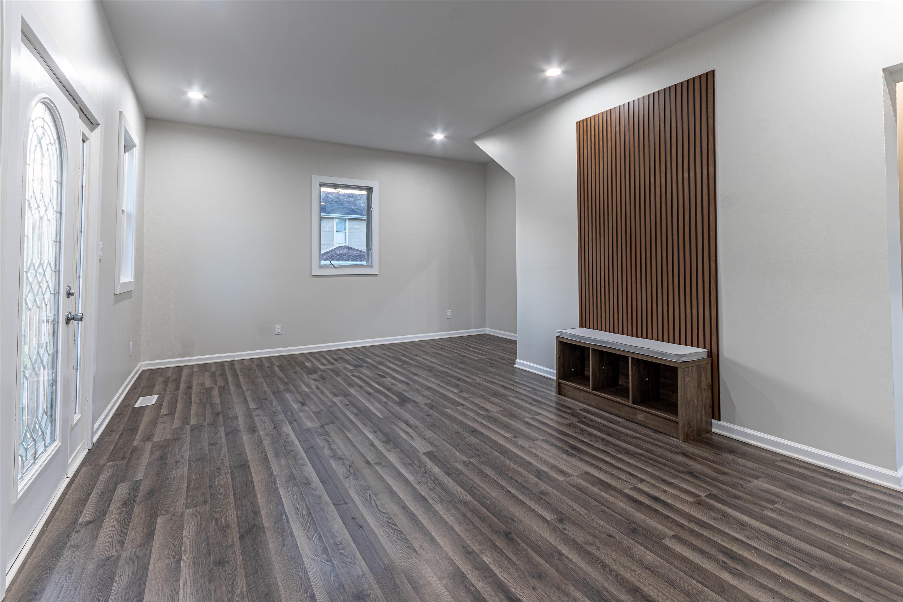 407 Allen Street Belvidere, IL 61008 - Photo 7 of 32 an empty room with wooden floor and windows