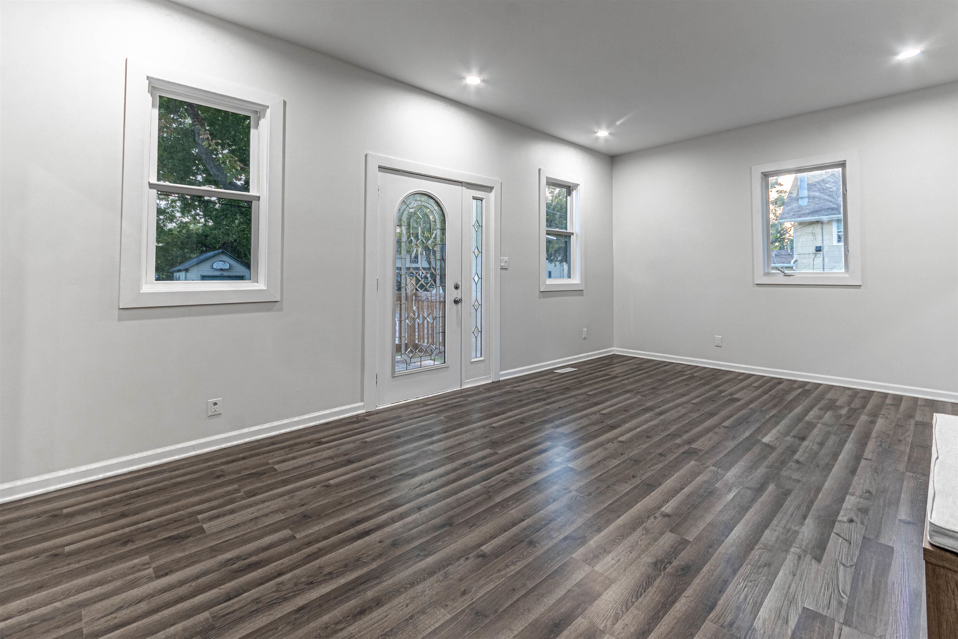 407 Allen Street Belvidere, IL 61008 - Photo 8 of 32 a view of empty room with wooden floor and fan