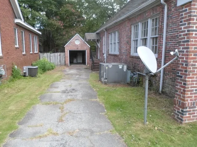a front view of a house with a yard and porch