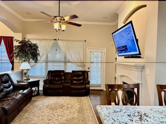 a living room with furniture or couch and a fireplace