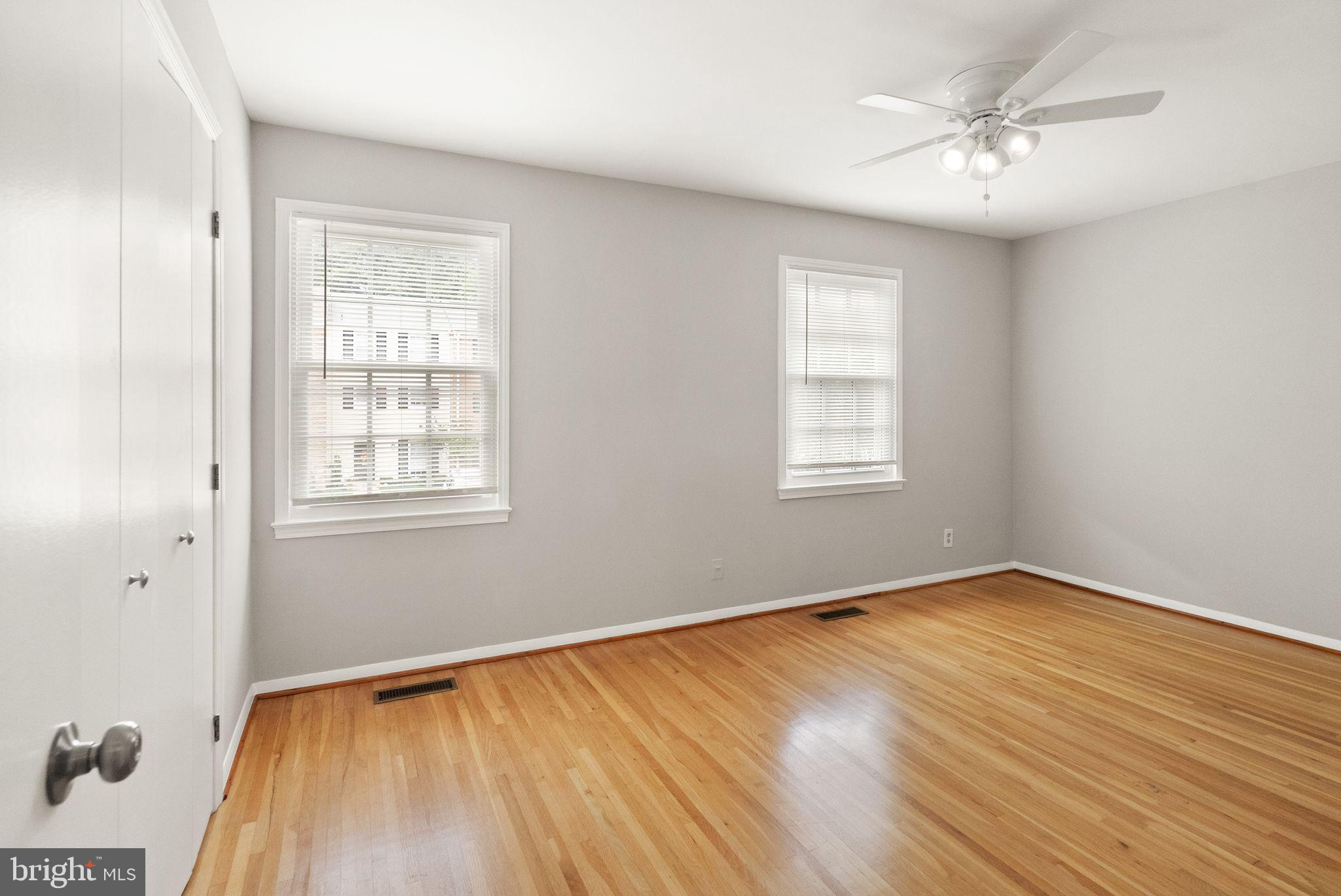 6611 Burlington Place Springfield, VA 22152 - Photo 14 of 41 an empty room with wooden floor and windows