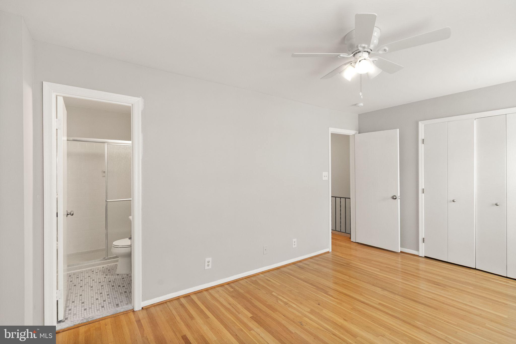 6611 Burlington Place Springfield, VA 22152 - Photo 15 of 41 a view of an empty room with wooden floor