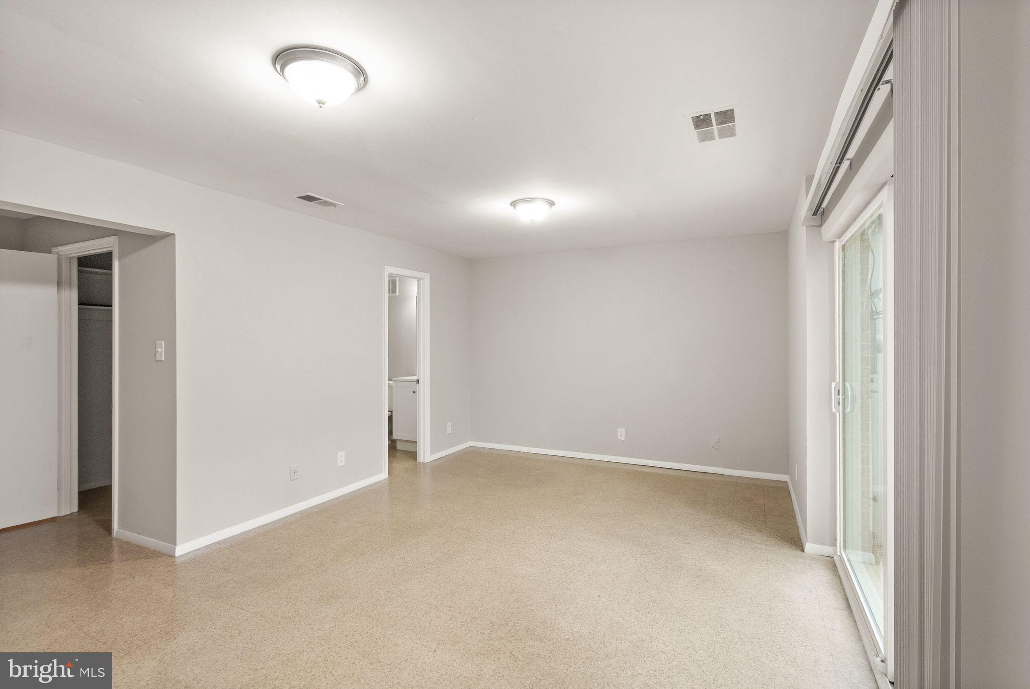 6611 Burlington Place Springfield, VA 22152 - Photo 27 of 41 an empty room with an entryway and fan