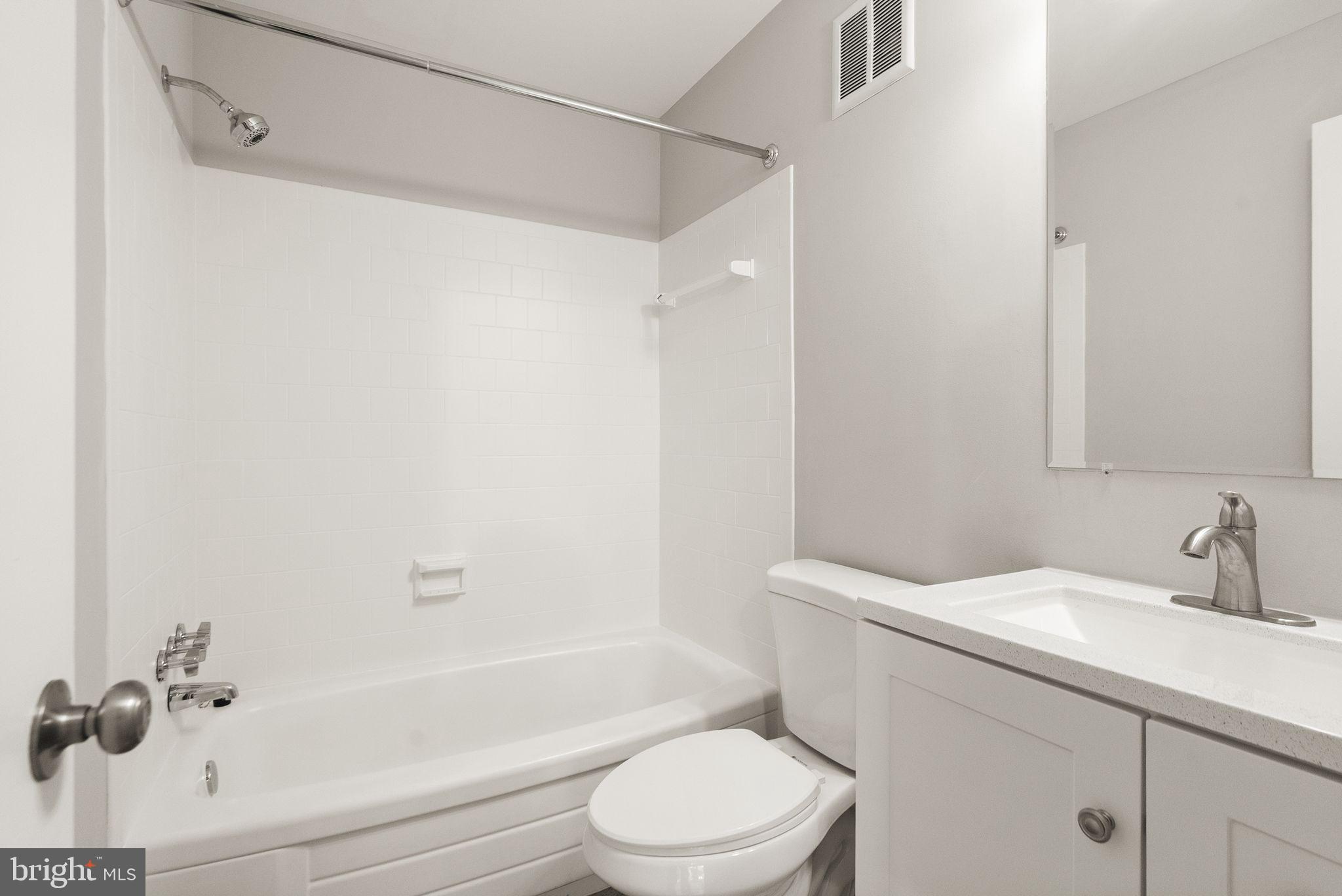 6611 Burlington Place Springfield, VA 22152 - Photo 29 of 41 a bathroom with a sink toilet and shower