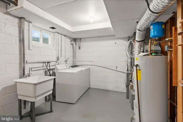 a view of a house with a wooden fence