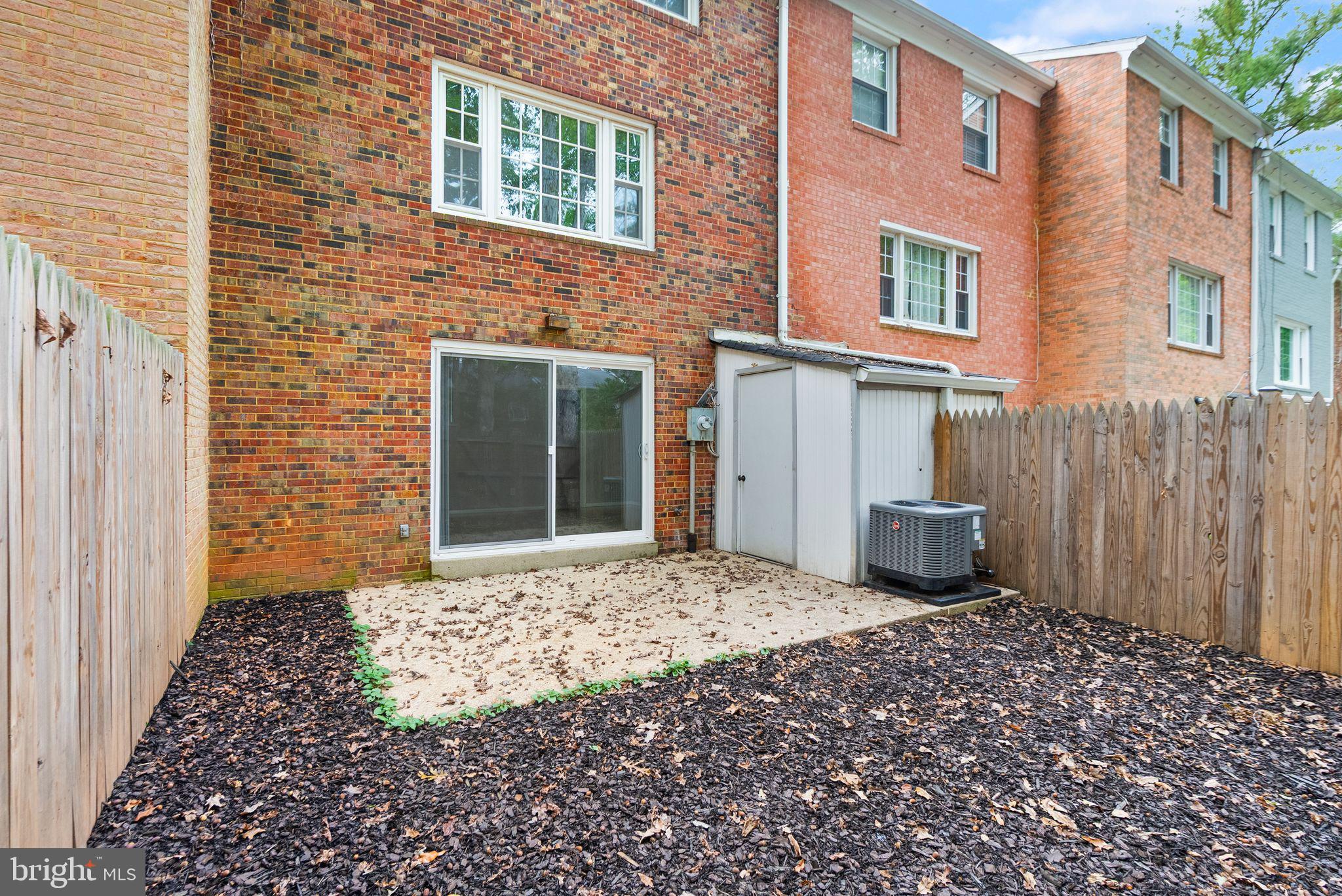 6611 Burlington Place Springfield, VA 22152 - Photo 33 of 41 a front view of a house with a garden